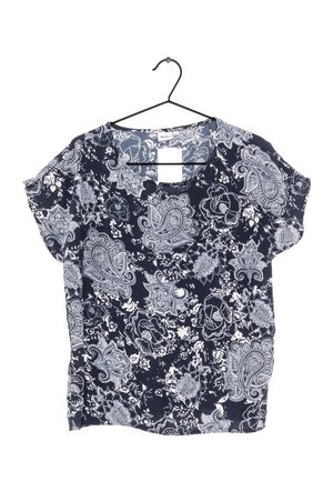 Marineblaue Bluse mit weißem Blumen- und Paisleymuster. Weicher Stoff, kurze Ärmel und ein quadratischer Ausschnitt mit einer Schlaufe zum Aufhängen.