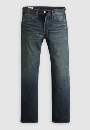 Donkerblauwe denim jeans met een rechte snit, vijf zakken en koperen klinknagels. De stof heeft een licht vervaagde afwerking, wat textuur en nerf laat zien.