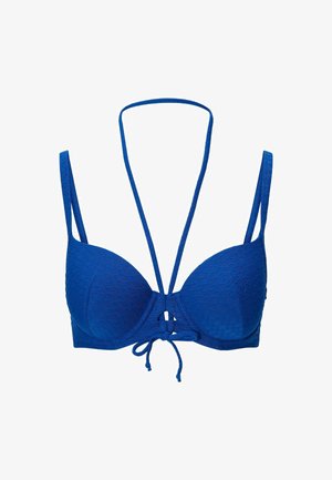 Soutien-gorge moulé bleu avec tissu texturé en motif losange, bretelles réglables et détail noué à l'avant. Léger et finition lisse.