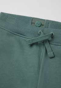 Groene katoenen joggingsbroek met een ribgebreide tailleband, een knoopsluiting en een aantrekkoord voor een veilige pasvorm.