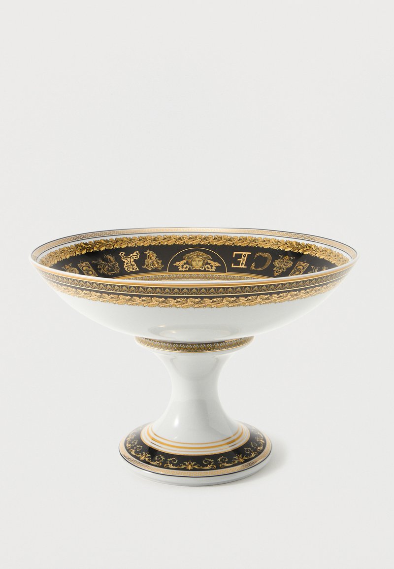 Λευκό πορσελάνινο μπολ με βάση, διακοσμημένο με  μαύρα και χρυσά περίτεχνα μοτίβα Μεδούσας και φυτικά σχέδια γύρω από τη στεφάνη και τη βάση.
