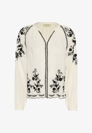 Blouse blanche avec broderie florale noire. Caractéristiques : manches longues, décolleté en V et ourlet festonné. Fabriquée à partir d'un tissu léger.