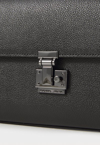 Black textured leather briefcase with silver metal clasp lock showing Emporio Armani logo plaque.