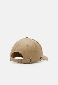 Lacoste Caps - beige