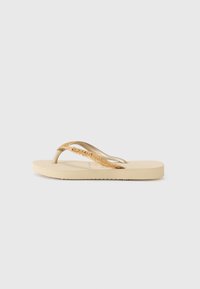 Vybráno, sand/gold-coloured