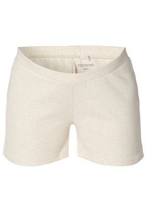 Light beige cotton shorts with a ribbed texture, featuring a wide waistband and side slits for ease of movement. Brand label visible inside.