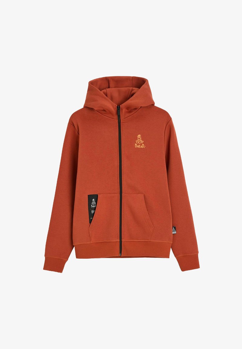 Bluza z kapturem na zamek w kolorze rdzawym pomarańczowym, z dużymi przednimi kieszeniami, czarnym zamkiem i małym logo Dakar na lewej piersi oraz kieszeni.