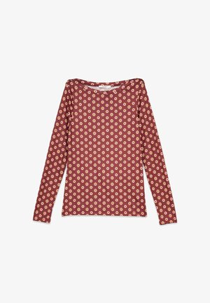 Haut à manches longues bordeaux en tissu doux, présentant un motif géométrique répété de hexagones jaunes et roses sur toute la surface.