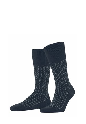 Paar dunkelblaue Knöchelsocken mit kleinem hellgrauem Punktmuster und einfarbigen gerippten Bündchen, Fersen und Zehen.
