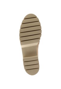 Semelle de chaussure en caoutchouc beige avec des rainures horizontales et un bout arrondi. Présente le logo 'hög' estampé près du talon. Texturée pour une meilleure adhérence.