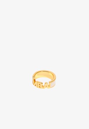 Gold-tone ring featuring cut-out lettering spelling "MBAL," with a smooth white accent band. Round shape, polished finish.