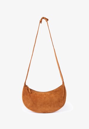 Brown suede crescent-shaped shoulder bag with adjustable strap and zipper closure on a white background.