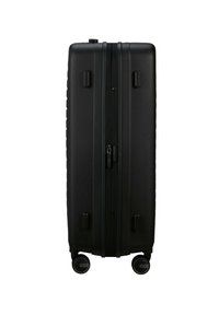 Black hard-shell suitcase with a smooth texture, vertical zipper closure, and four wheels for mobility. Features rounded edges and dual side handles.