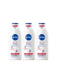 Three Nivea Repair & Care body lotion bottles with 72h hydration, glycerin, provitamin B5, and niacinamide for very dry, rough skin.