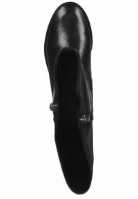 Black leather ankle boot with a smooth finish, almond-shaped toe, side zippers, and minimal hardware accents. Sole has textured tread.