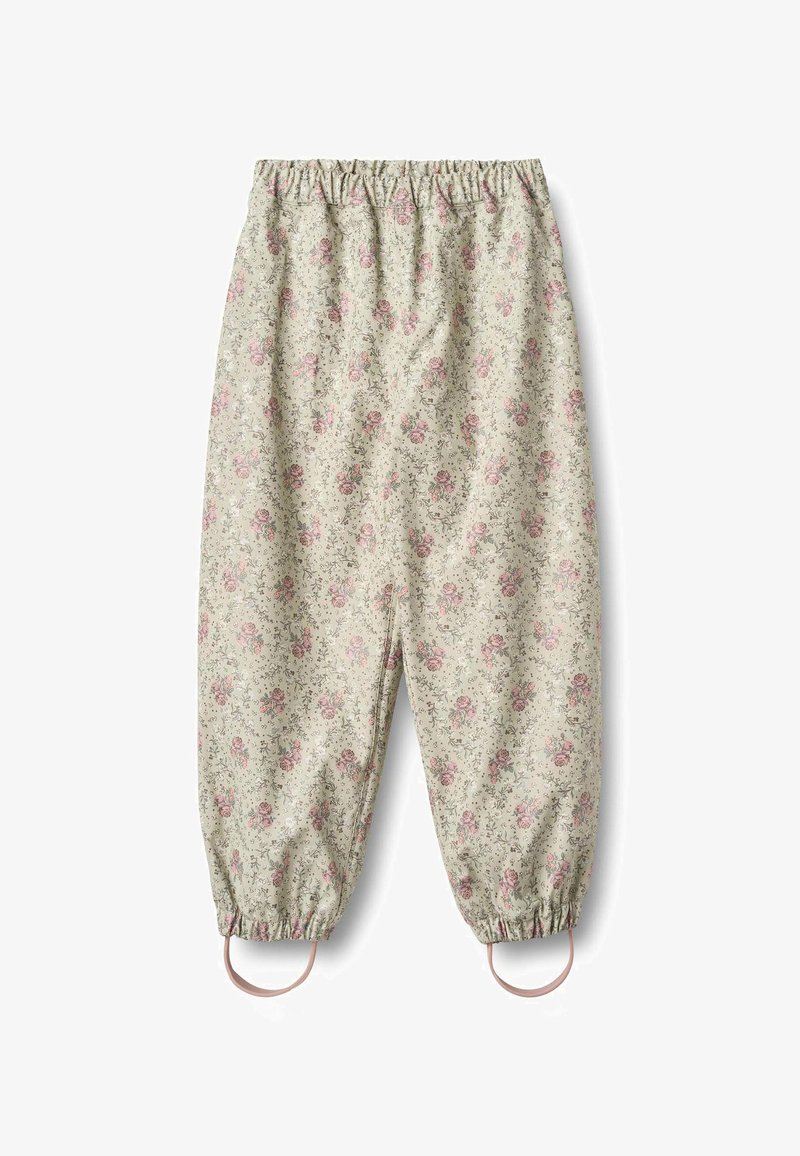 Nohavice s kvetinovým vzorom na tlmenom béžovom pozadí, zdobené ružovými ružami, s elastickým pásom a nariasenými manžetami s očkovými detailmi.