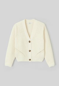 Cardigan en tricot crème avec un col en V, fermeture à boutons et manches longues. Il présente une couture décorative et deux poches à l'avant.
