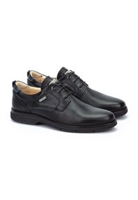 Chaussures habillées en cuir noir avec un design à lacets, texture lisse, subtils détails de couture et une semelle en caoutchouc pour une bonne adhérence et confort.