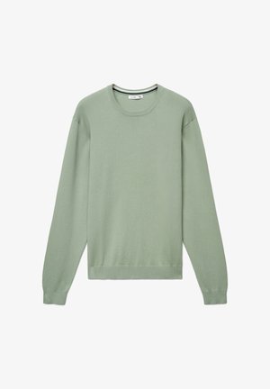 Maglione verde chiaro, trama a maglia, maniche lunghe, scollatura rotonda, polsini e orlo a coste. Design semplice, senza decorazioni. Etichetta con taglia XL visibile.