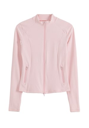 Vaaleanpunainen naisten takki, jossa on pitkät hihat, korkea kaulus, edessä vetoketju ja kaksi vetoketjullista sivutaskua.