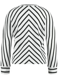 Zwart-witte gestreepte pullover trui met een zigzagpatroon, lange mouwen, geribbelde manchetten en een geweven textuur.