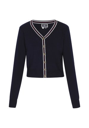 Marineblauwe cardigan met lange mouwen, V-hals en gouden knopen. Heeft witte en rode gestreepte accenten langs de kraag en de knopenlijst.