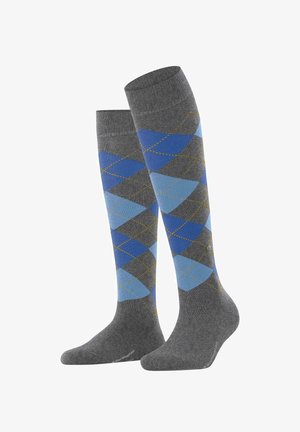 Grijs kniekousen met een argyle patroon met blauwe ruitvormen en gele accenten. Gemaakt van zachte, rekbare materialen.