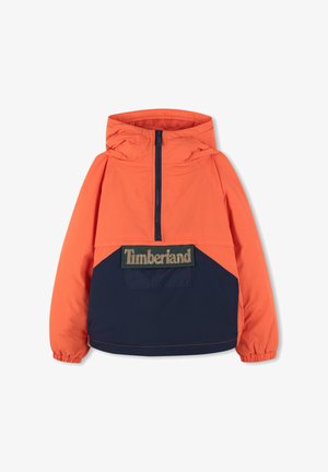Giacca anorak color block arancione e blu navy con cappuccio, zip a metà sul davanti e grande patch con il logo Timberland sul petto. Tessuto leggero.