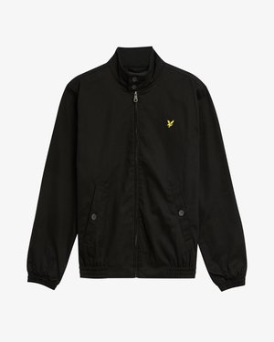 Veste noire en nylon avec fermeture éclair, col montant, poignets élastiques, deux poches avant et un petit logo jaune sur la poitrine.