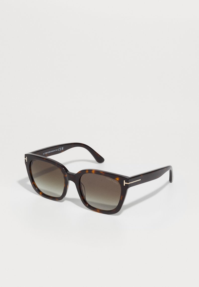 Tortoiseshell sunglasses with square lenses, gradient shading. Silver accents on arms. Made of glossy plastic with a smooth texture.