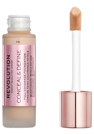 Flytende foundation i en klar flaske med en rosa etikett. Har en hvit applikator med en myk, avrundet tupp. Fargen ser ut til å være lys beige.