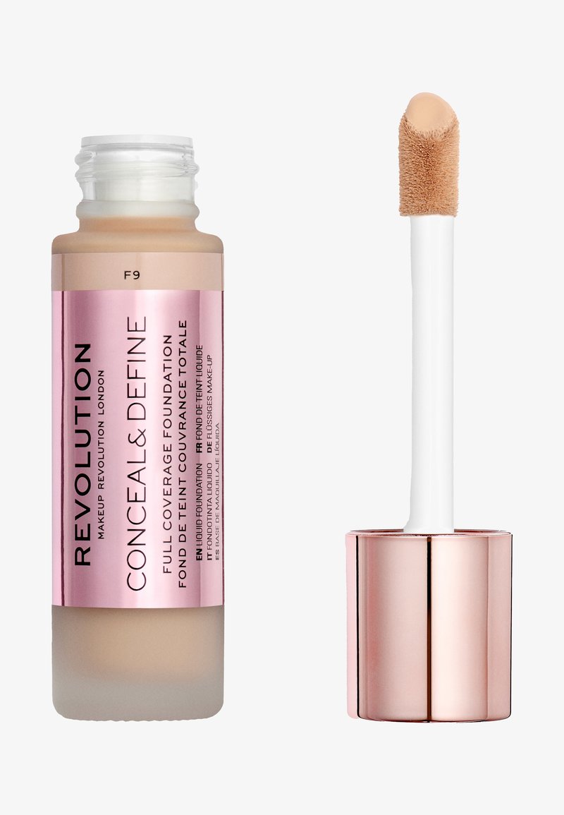 Fond de teint liquide dans une bouteille transparente avec une étiquette rose. Présente un applicateur blanc avec un embout doux et arrondi. La couleur semble beige clair.