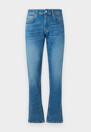 Blå denim flared jeans med middels høyt liv, to frontlommer og lett falming. Stoffet har en myk tekstur og tradisjonell søm.