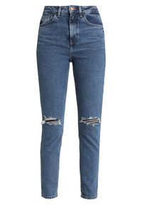 Jean skinny taille haute en denim bleu foncé, avec des déchirures usées au niveau des genoux et un design classique à cinq poches.