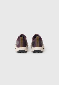 Purple and gray trail shoes with textured fabric, a speckled cream midsole, and black rubber outsole; features a yellow heel pull tab.