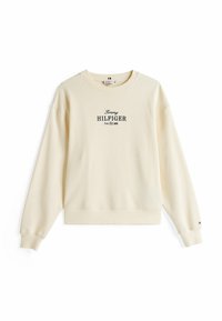 Crème-kleurige sweatshirt met lange mouwen, ronde halslijn en geribbelde manchetten. Heeft het 'Tommy HILFIGER' logo in donkerblauw op de middel.
