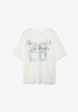 Weißes Kurzarm-T-Shirt aus Spitze mit dem auf der Vorderseite im Used-Look aufgedruckten Schriftzug "85 LA Los Angeles 60".