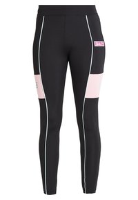 Zwarte leggings van rekbare stof, met roze accenten aan de zijkanten, witte biezen en een roze "Barbie"-logo.