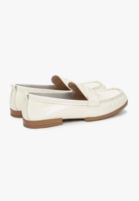 White leather loafers with a smooth finish, featuring a rounded toe, stitched detailing, and a low tan rubber sole.