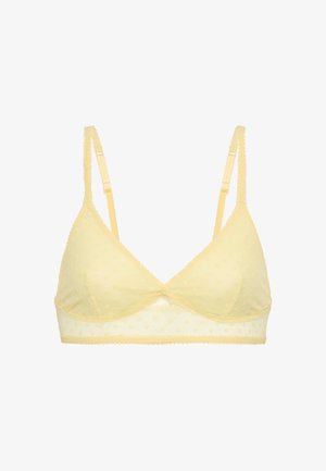 Yellow bralette made of sheer fabric with dotted texture, featuring adjustable straps and scalloped trim along the edges.