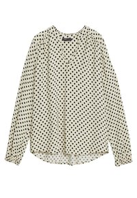 Langærmet bluse i creme med sorte prikker, med v-udskæring, samlet skuldre og en buet kant ved taljen.