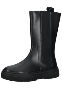 Black leather ankle boots with elastic panels, round toe, and thick rubber sole featuring vertical grooves for traction.