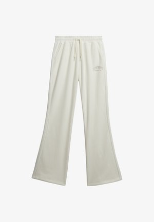 Crème-kleurige sweatpants in een relaxte fit, gemaakt van zacht materiaal. Heeft een elastische tailleband, een trekkoord en geborduurd logo.