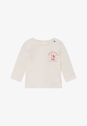 Beżowa koszulka z długim rękawem wykonana z miękkiej bawełny, ozdobiona czerwonym nadrukiem o tematyce morskiej oraz z bocznym zatrzaskiem dla łatwego zakładania.