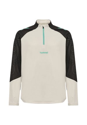 Sportowy top z długim rękawem z beżowym korpusem, czarnymi wzorzystymi ramionami i rękawami, turkusowym zamkiem błyskawicznym i logo hummel na piersi.