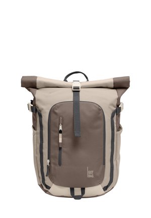 Beige and brown roll-top backpack with front zip pocket and black straps, labeled "GOT BAG" in the lower right corner.