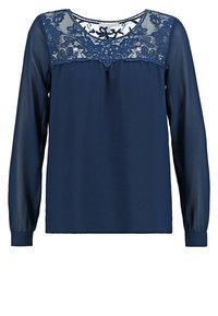 Blouse bleu marine à manches longues avec manches transparentes et détails en dentelle sur le haut de la poitrine et les épaules.