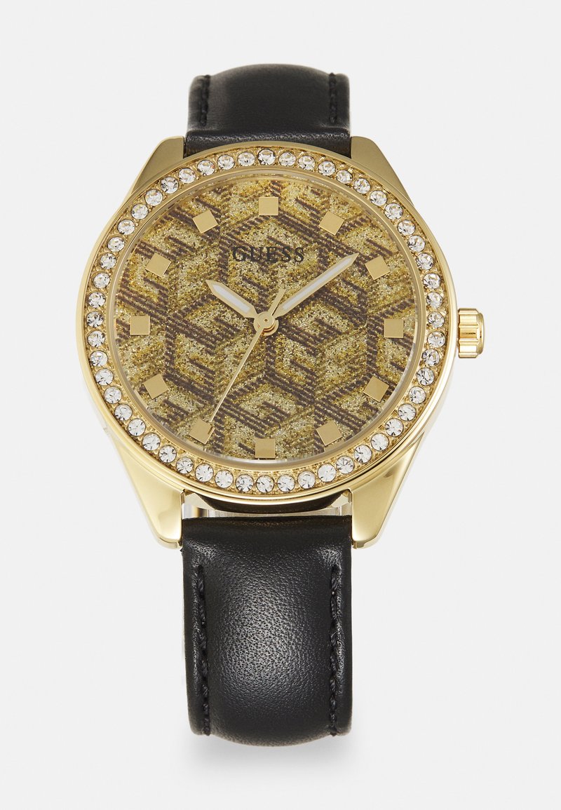 Goldfarbener Uhr mit einem strukturierten gold- und braunmuster Dial, umgeben von einer mit Kristallen besetzten Lünette, an einem schwarzen Lederarmband.