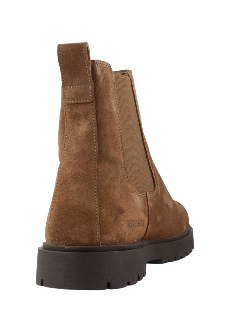 Braune Wildleder-Stiefelette mit elastischen Seitenteilen, runder Zehenform und einer strukturierten Gummisohle. Unauffällige Branding-Anbringung an der Ferse.