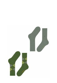 Due paia di calzini verdi sono esposti: uno di un verde uniforme e l'altro decorato con un motivo a rombi in diverse tonalità di verde e grigio.